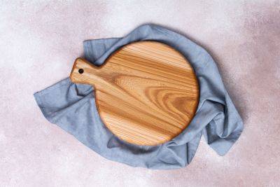 Why You Should Always Put a Damp Towel Under Your Cutting Board - bhg.com